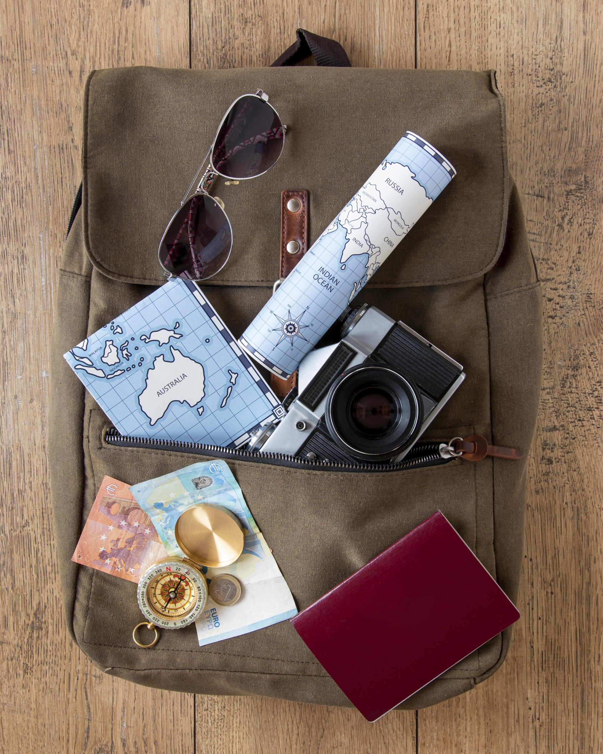 tourism-items-assortment-wooden-background
